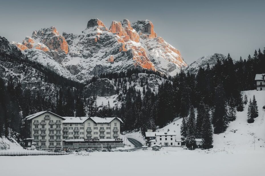 Chalet en bois avec vue sur les pistes enneigées des Alpes franco-suisses